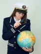 Girl in a sea uniform with the globe