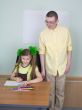 Girl and brother with pencils
