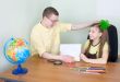 Girl shows new drawing to the brother