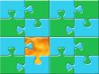 green and blue puzzle surface with one golden piese