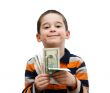 Cute little boy holds banknotes