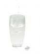 glass with water and aspirin pills
