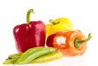 Different fresh tasty peppers on white wet background