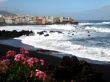 the black volcanic beach and the waves