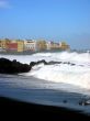 the black volcanic beach and the waves