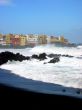 the black volcanic beach and the waves