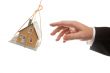 Swinging House and Business Man`s Hand Reaching or Pushing