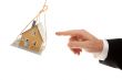 Swinging House and Business Man`s Hand Reaching