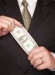 Businessman Holding Dollar Bill