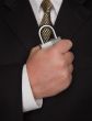 Businessman Holding Large Lock