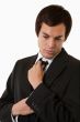 Man fixing tie