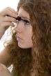red haired female teenager with mascara
