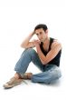 Handsome guy sitting on floor