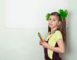 Girl with color pencils and a sheet of paper