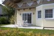 Garden armchair in front of house
