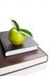 Books and green apple