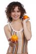 Beautiful woman with oranges.
