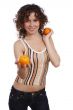 Smiling young healthy woman is holding the orange.