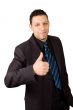 happy aruban businessman is puthing his thumb  up