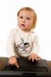 Adorable baby with laptop
