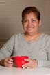 Woman having a cup of coffee at home