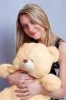 blonde girl with teddy bear