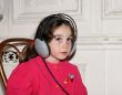 Cute little girl in earphones