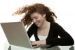 red haired teenager with laptop