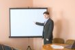 Businessman near the white screen