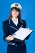 Woman in sea uniform with tablet