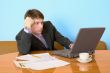Businessman on a workplace with the laptop