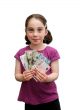 Smiling little girl holds a fan of banknotes