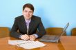 Businessman at a table with laptop