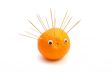 Funny hedgehog made of orange and toothpicks