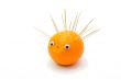 Funny hedgehog made of orange and toothpicks