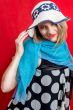 blonde in beach hat