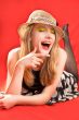 laughing blonde in beach hat