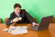 Businessman on a workplace with the laptop