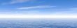 Blue cludy sky and ocean water with waves - panorama