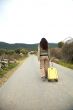 woman walking with suitcase