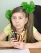 Girl with color pencils in hands