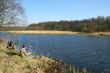 Fisherman sitting on the river shore