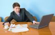 Businessman on a workplace with the laptop