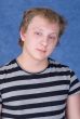 Tousled guy in a striped T-shirt