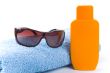 towel, sunglasses and lotion