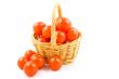 basket full of fresh healthy baby tomatoes on white