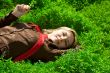 Lying in green grass