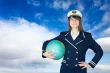 Girl in sea uniform and globe