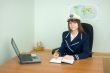 Girl - sea captain at office with laptop
