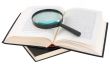 Open book and magnifier
